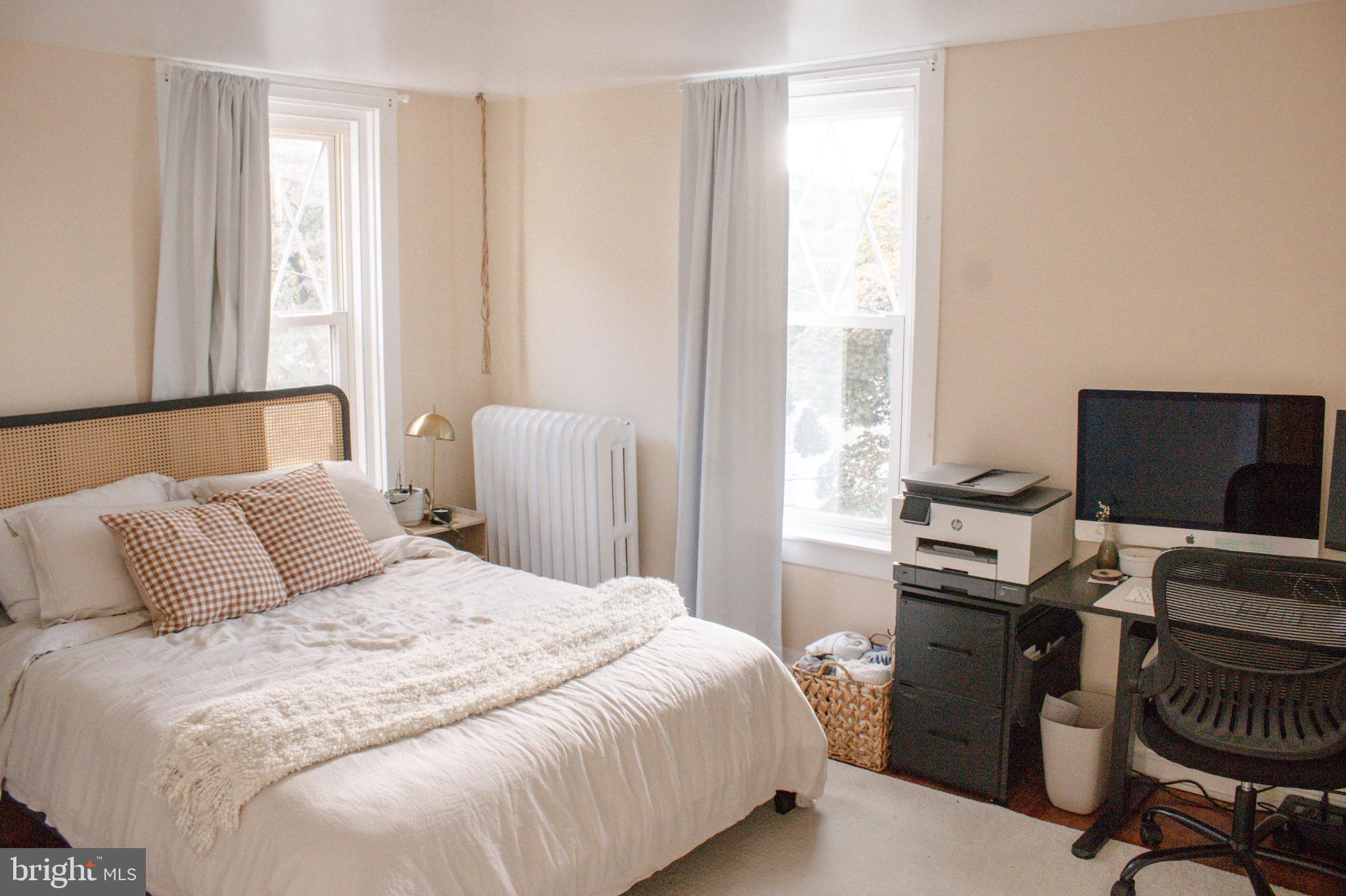 320 South Sterley Street Reading, PA 19607 - Photo 8 of 23 Cozy bedroom with natural light and charm.