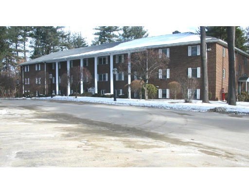 209 Great Road, Unit B6 Acton, MA 01720 - Photo 1 of 1 a black white building with a outdoor space