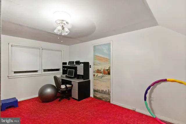 a kitchen with stainless steel appliances a dining table chairs and a chandelier