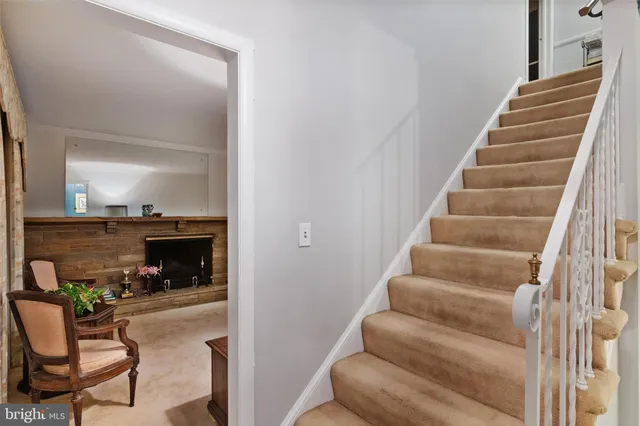 a view of entryway and hall with dining room