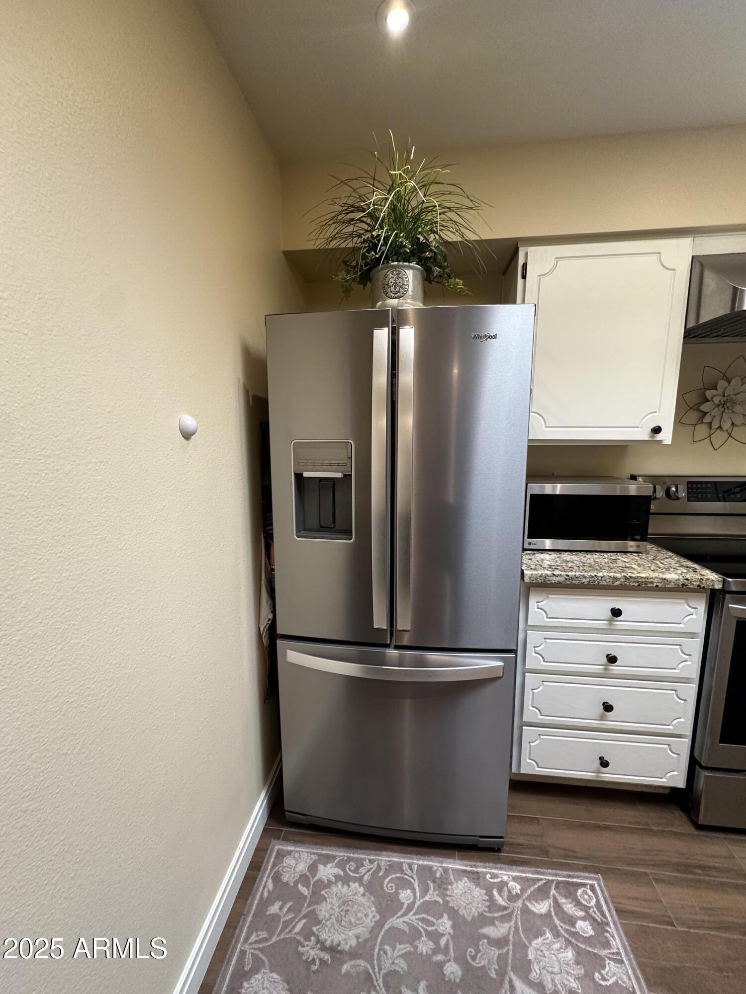 4328 East Capri Avenue, Unit 180 Mesa, AZ 85206 - Photo 13 of 38 a glass walk in closet