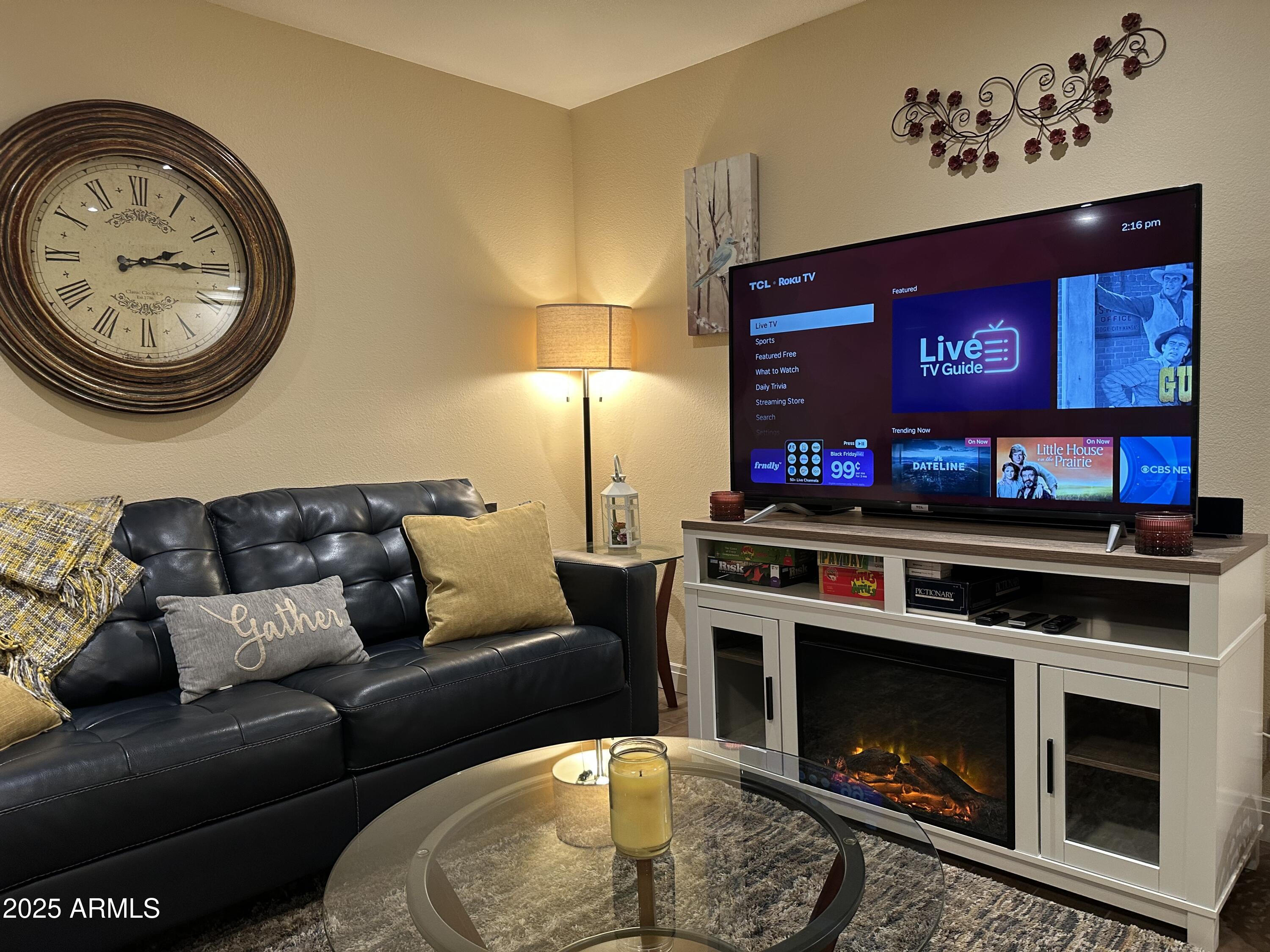 4328 East Capri Avenue, Unit 180 Mesa, AZ 85206 - Photo 14 of 38 a living room with furniture and a fireplace