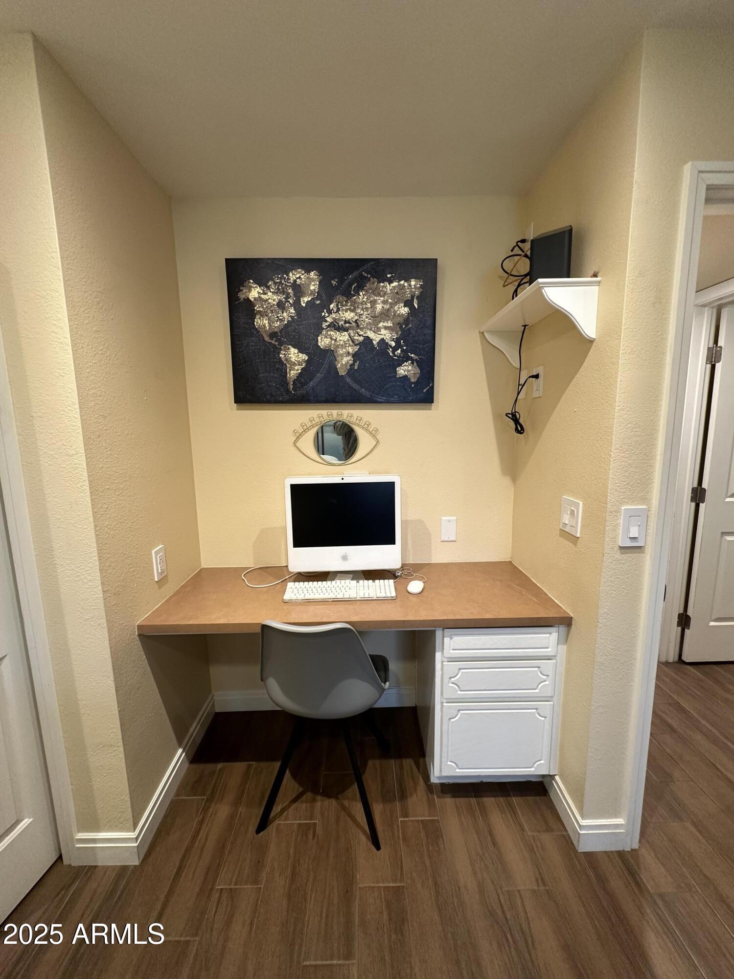 4328 East Capri Avenue, Unit 180 Mesa, AZ 85206 - Photo 16 of 38 a workspace with furniture and wooden floor