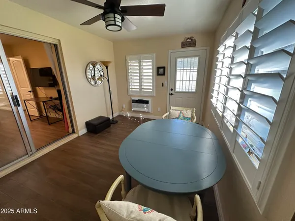 a view of a livingroom with furniture and a window