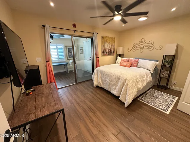 a bathroom with a granite countertop toilet sink and mirror
