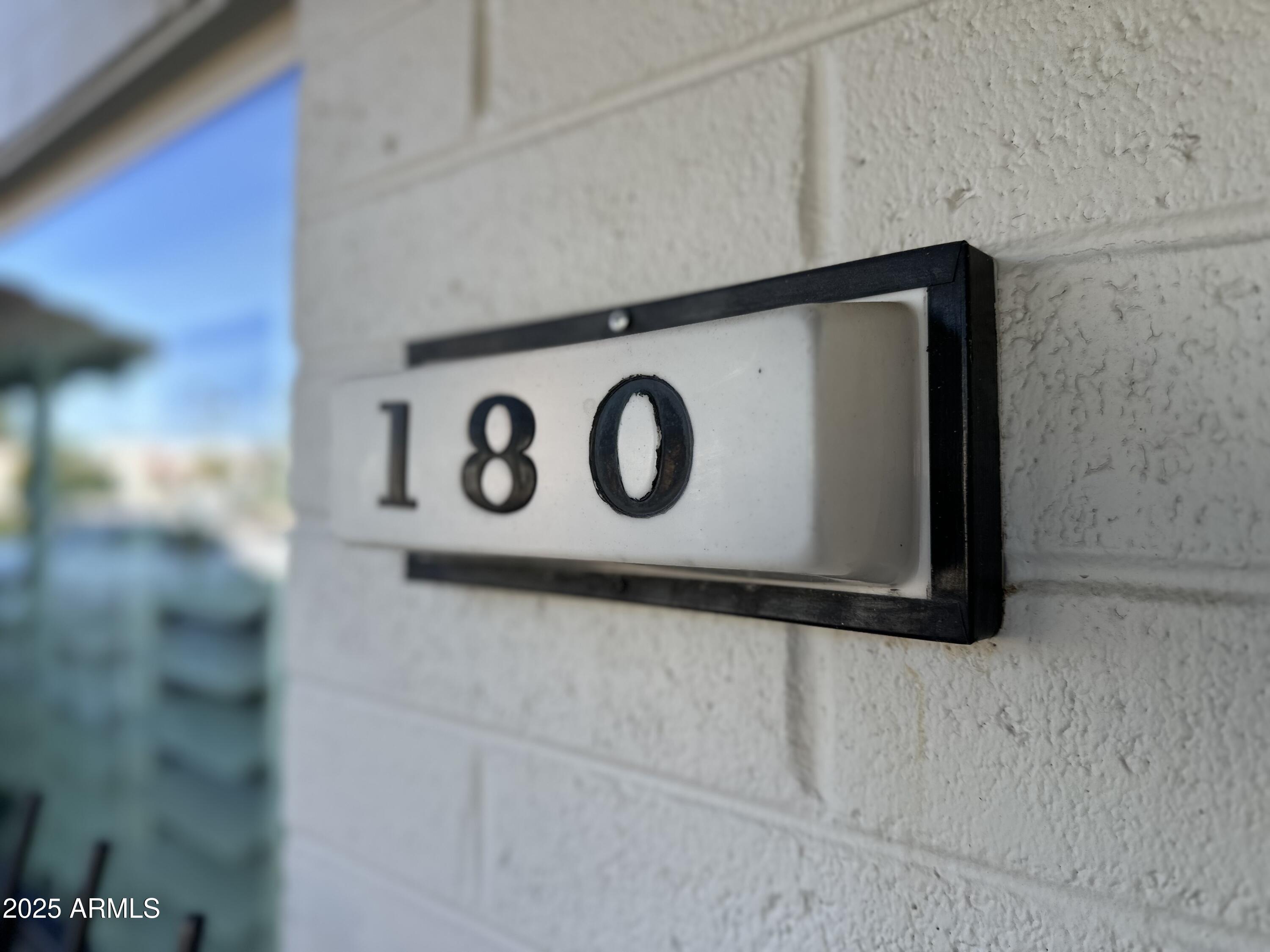 4328 East Capri Avenue, Unit 180 Mesa, AZ 85206 - Photo 3 of 38 a close up of a sign on a wall
