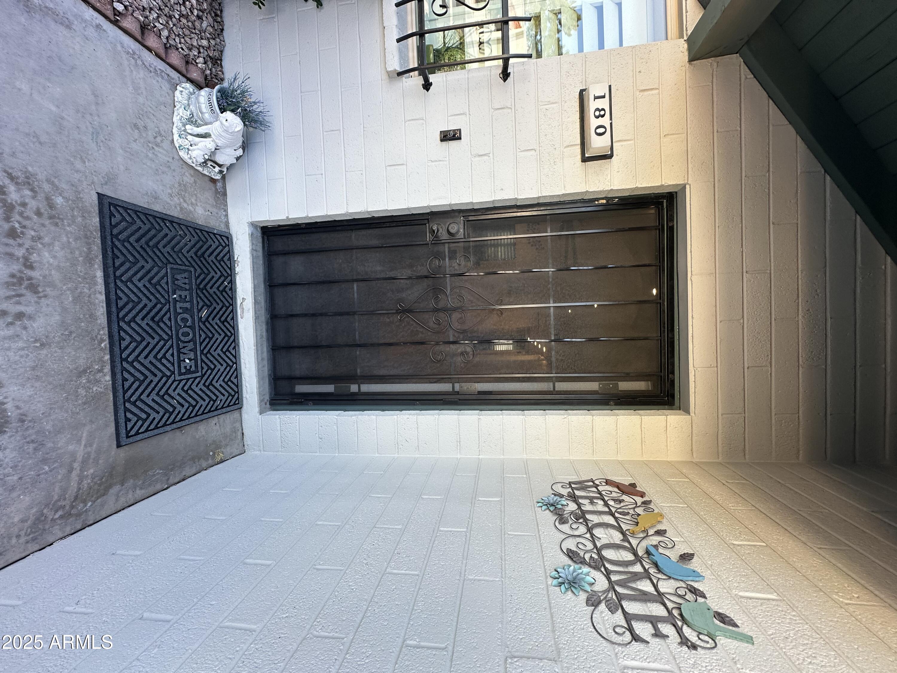 4328 East Capri Avenue, Unit 180 Mesa, AZ 85206 - Photo 35 of 38 a view of a entryway door front of a house