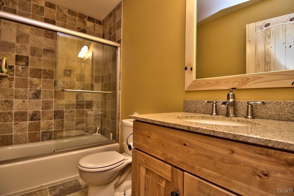 104 Rhododendron Road Jim Thorpe, PA 18229 - Photo 25 of 48 The 1st floor full bath has a tile floor & tub sur