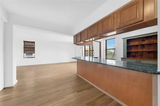 a view of lot of kitchen and wooden floor