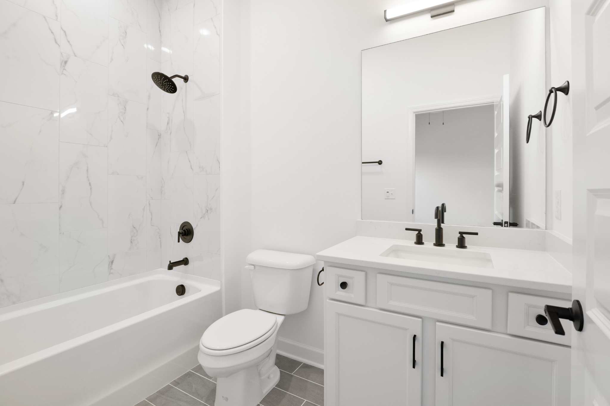 357 B Wellows Chase Spring Hill, TN 37174 - Photo 20 of 25 a bathroom with a sink a toilet and a bathtub