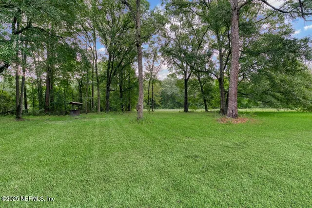 a bedroom with a bed and a chair