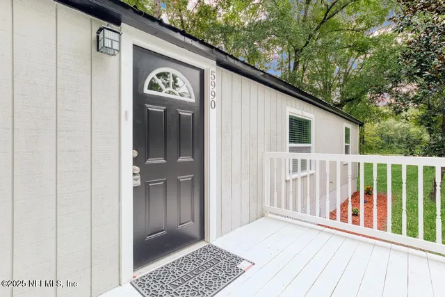 a view of a door and a window