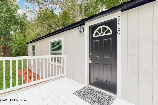 a view of living room and kitchen
