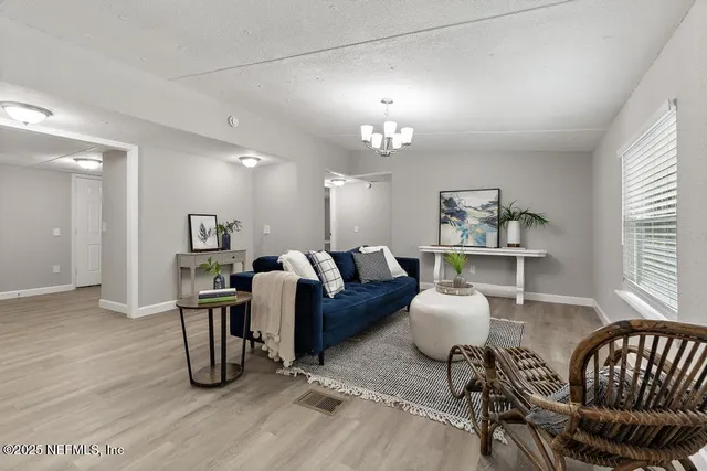 a view of a chairs and a table in a room