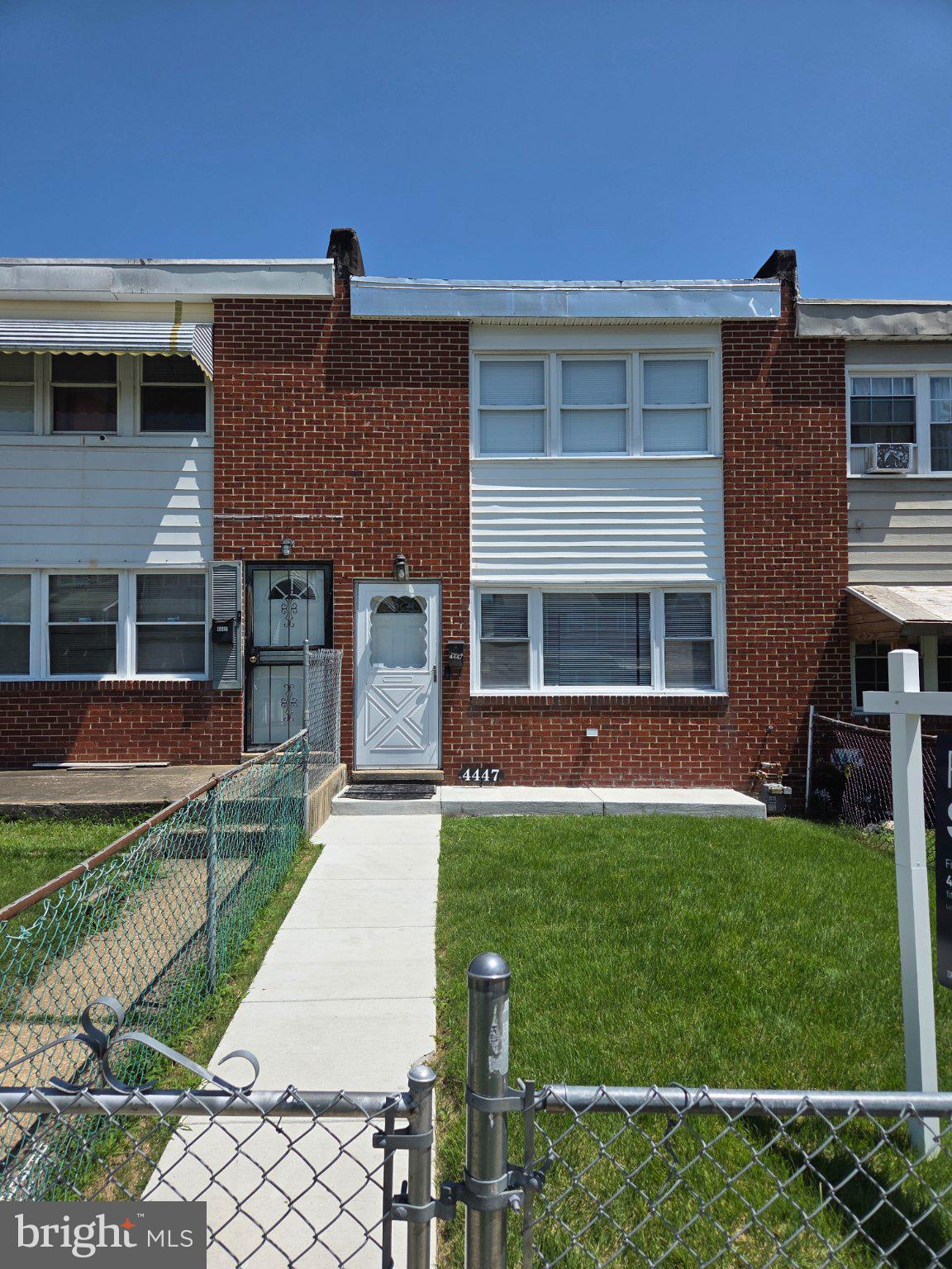 4447 Norfen Road Baltimore, MD 21227 - Photo 29 of 38 Charming brick townhouse with green lawn.