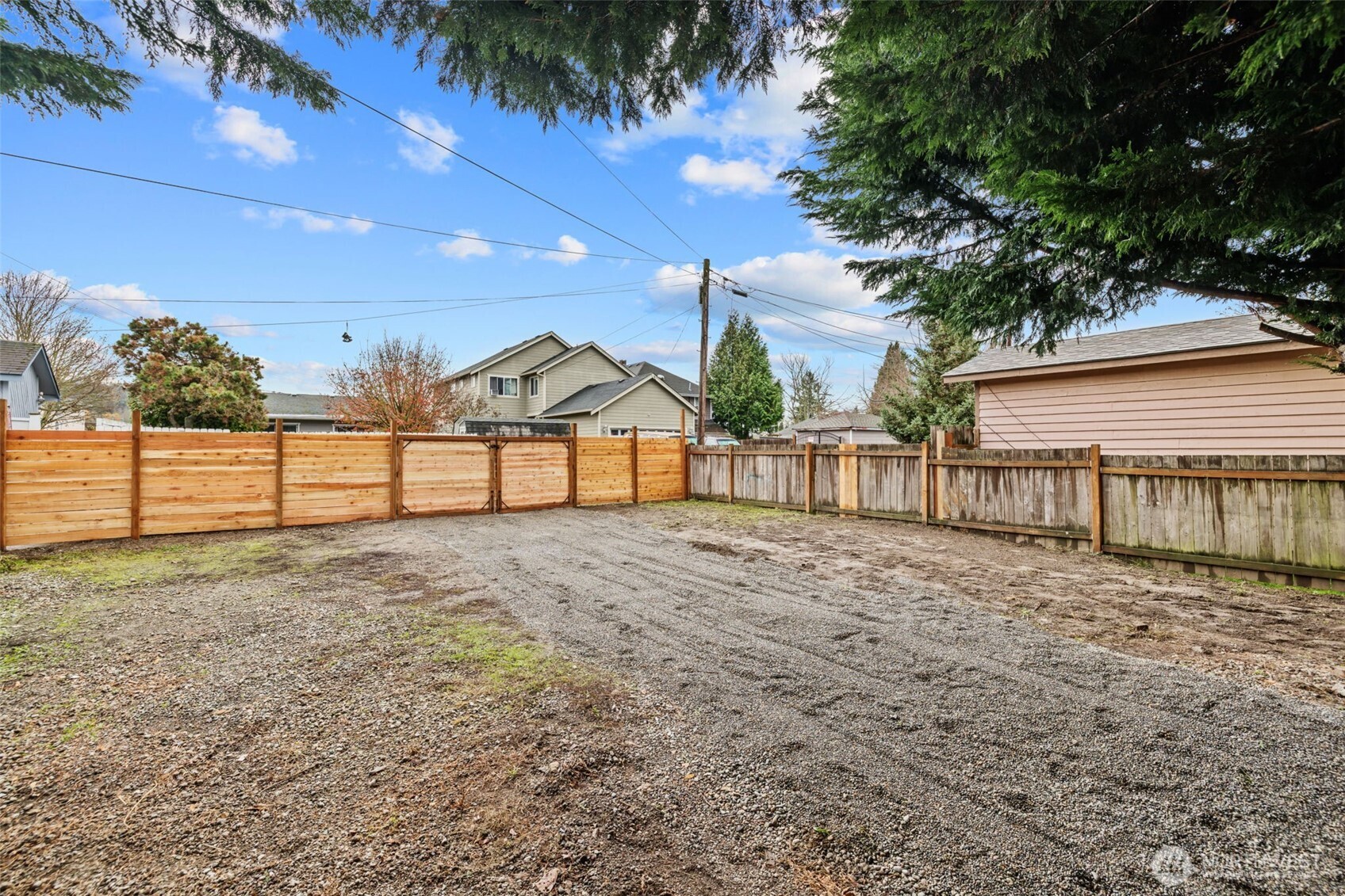 1521 North 3rd Street Renton, WA 98057 - Photo 2 of 18 a view of backyard and trees