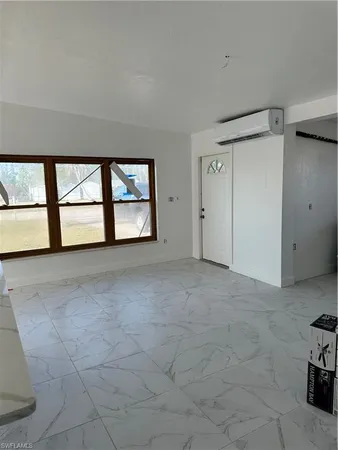 a view of empty room with windows