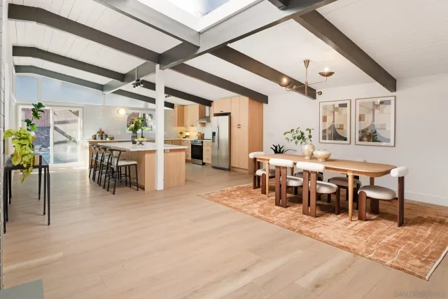 a kitchen with stainless steel appliances a stove a refrigerator and a cabinets