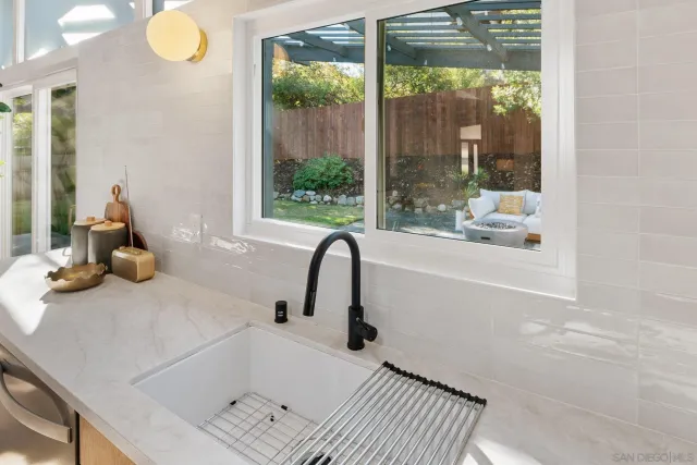a view of a dining room with furniture and window