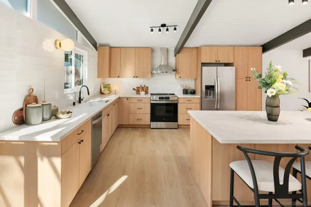 a bedroom with furniture and a potted plant