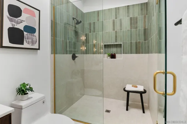 a view of backyard with outdoor seating and wooden fence