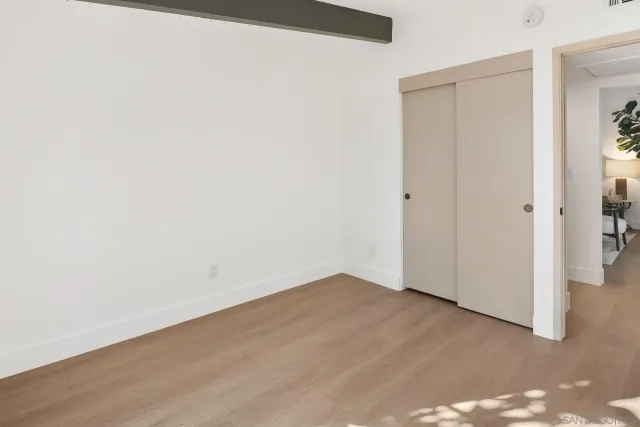 a view of a house with backyard and a garden