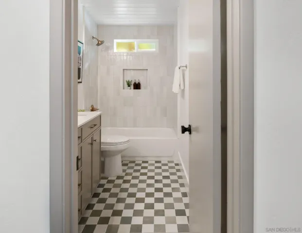 a view of a chair and table in backyard
