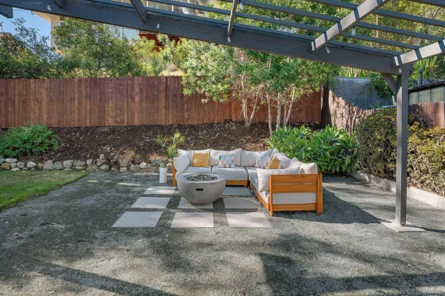 a view of a house with a yard and plants