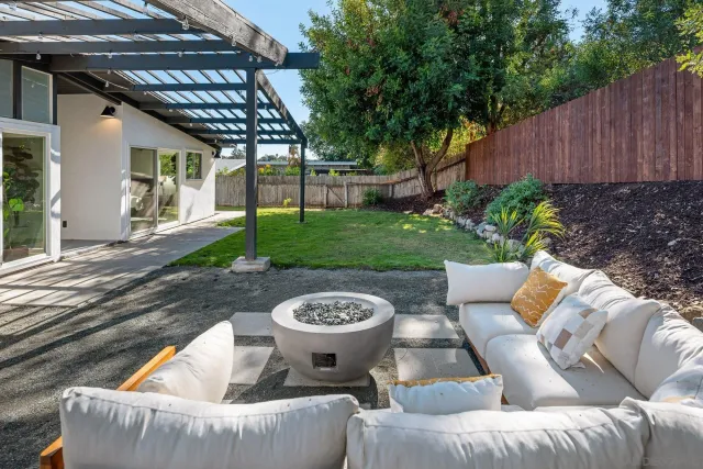 an aerial view of residential houses with city view