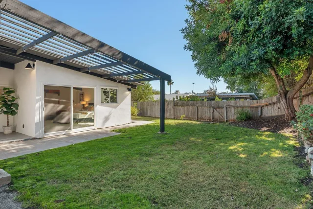 an aerial view of a house with a garden