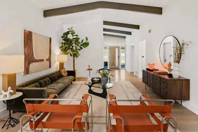 a kitchen with stainless steel appliances a stove a sink and a refrigerator