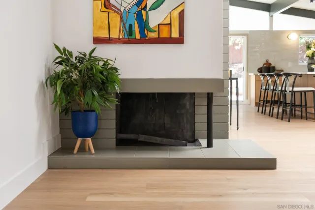 a view of a dining room with furniture and a chandelier