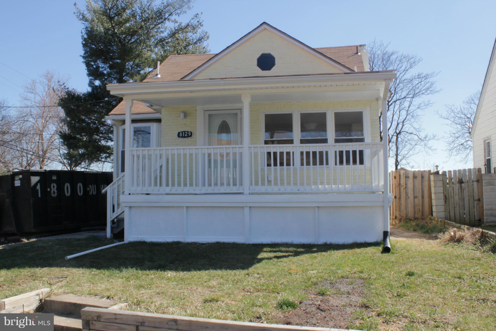 8129 Old Philadelphia Road Baltimore, MD 21237 - Photo 1 of 25 a front view of a house with garden