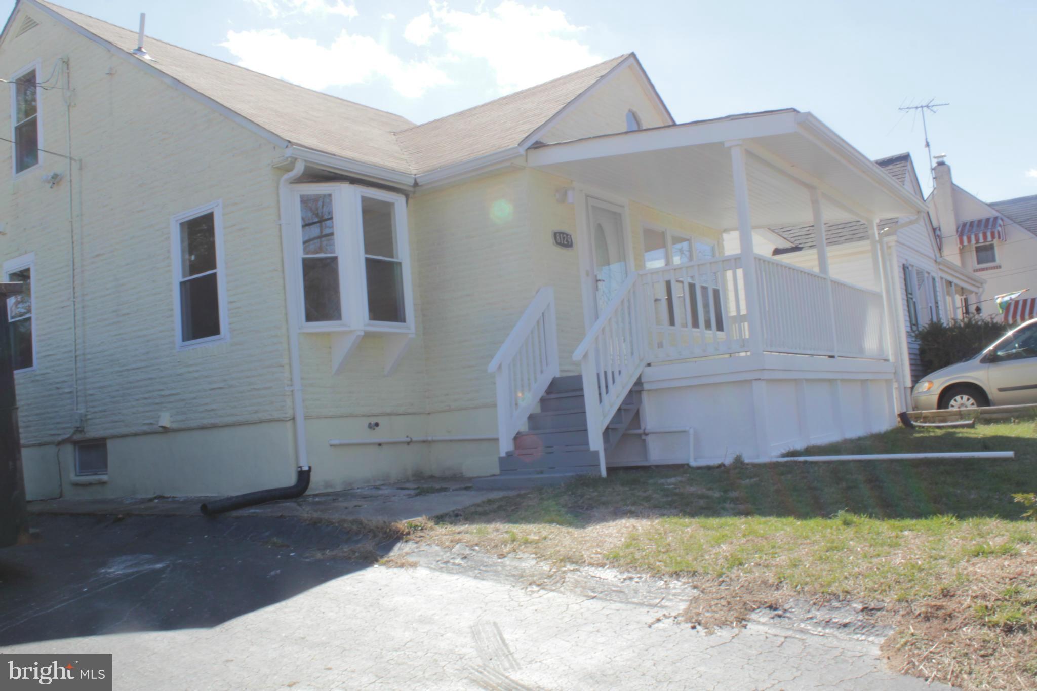 8129 Old Philadelphia Road Baltimore, MD 21237 - Photo 2 of 25 a view of a house with a yard