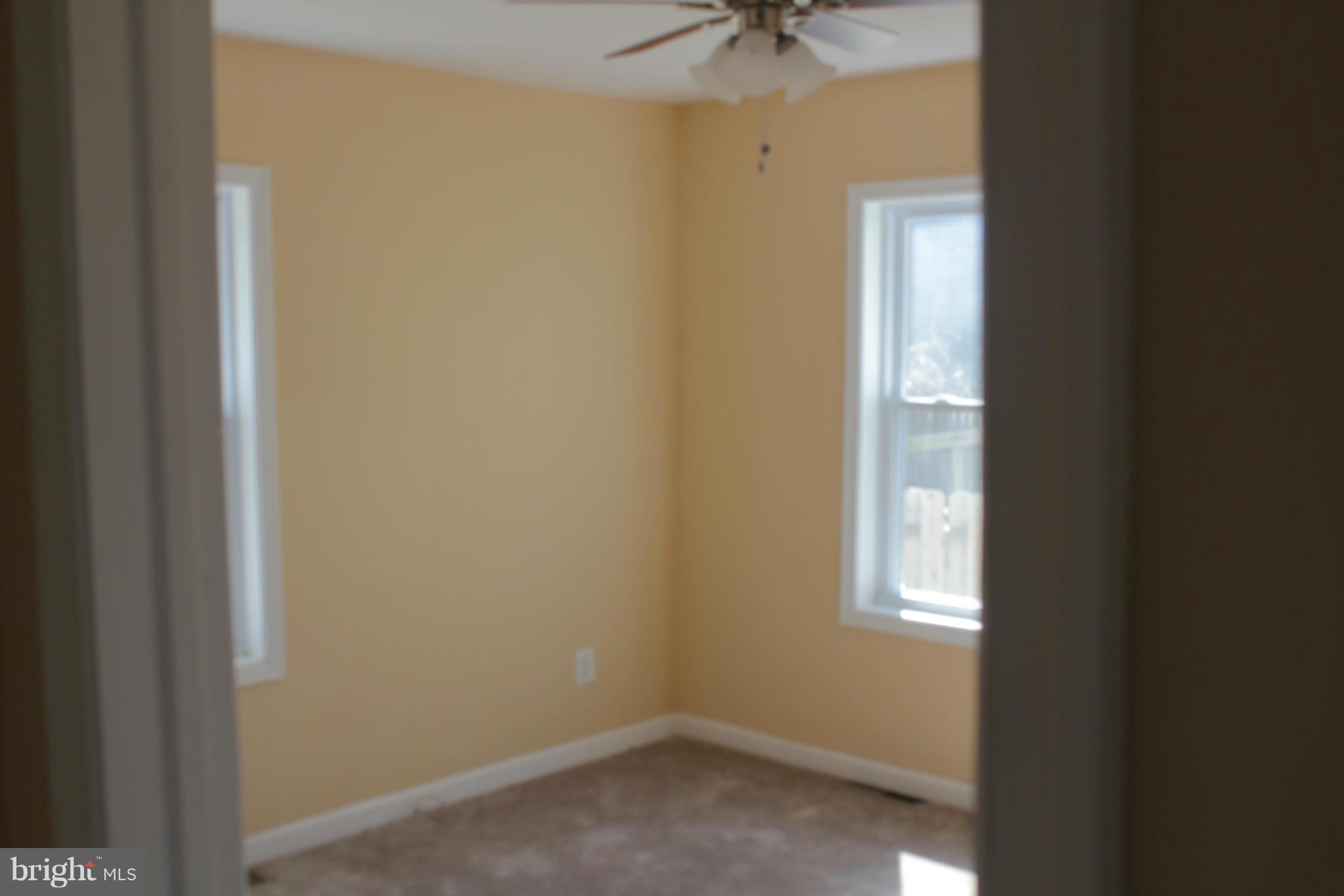 8129 Old Philadelphia Road Baltimore, MD 21237 - Photo 12 of 25 a view of an empty room with a window