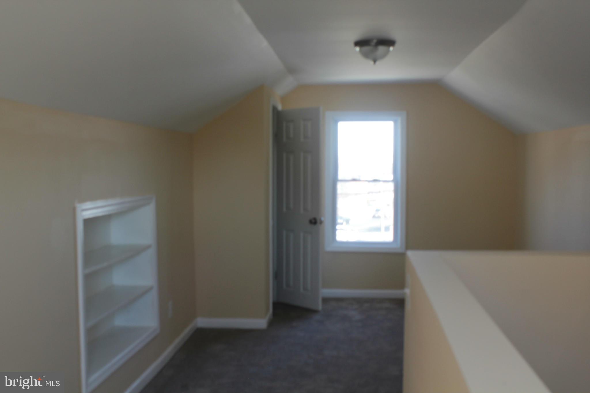 8129 Old Philadelphia Road Baltimore, MD 21237 - Photo 16 of 25 a view of an empty room and window