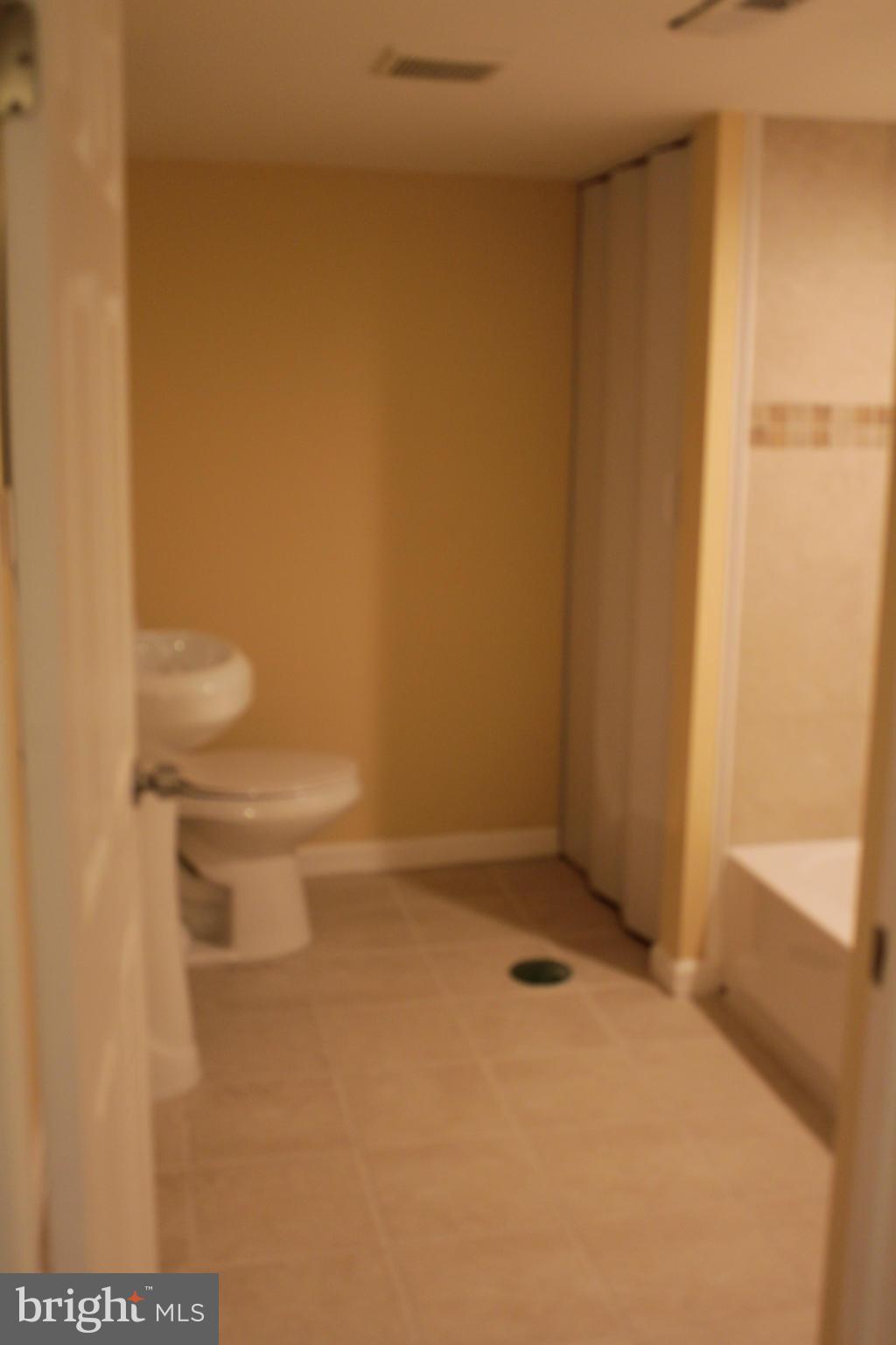 8129 Old Philadelphia Road Baltimore, MD 21237 - Photo 19 of 25 a bathroom with a white wall
