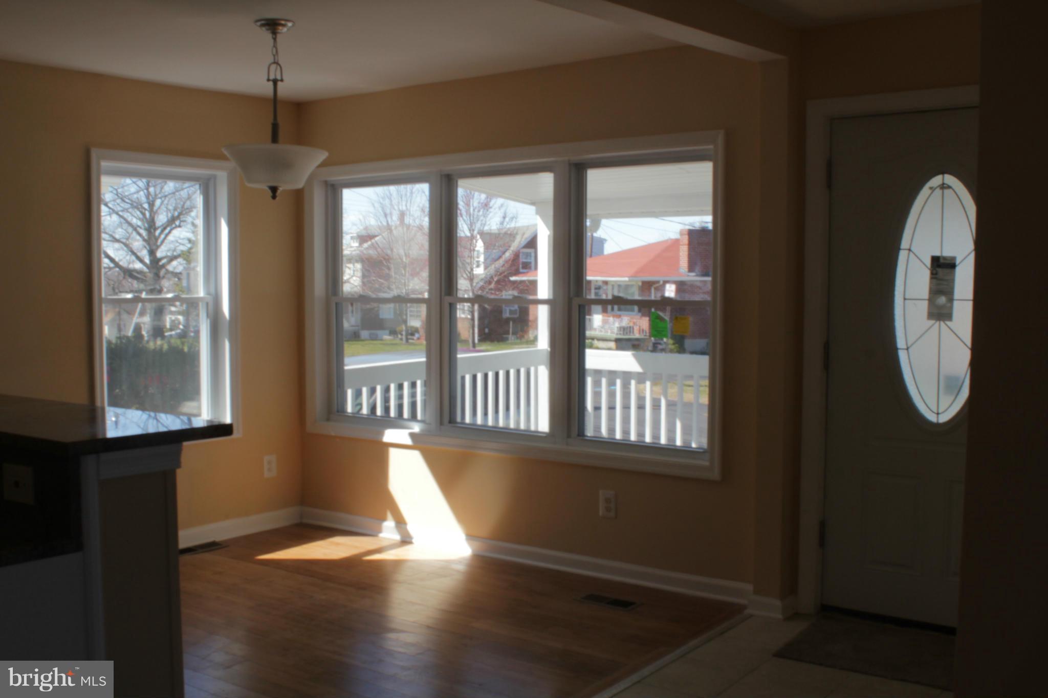 8129 Old Philadelphia Road Baltimore, MD 21237 - Photo 7 of 25 a view of entryway and hall with wooden floor