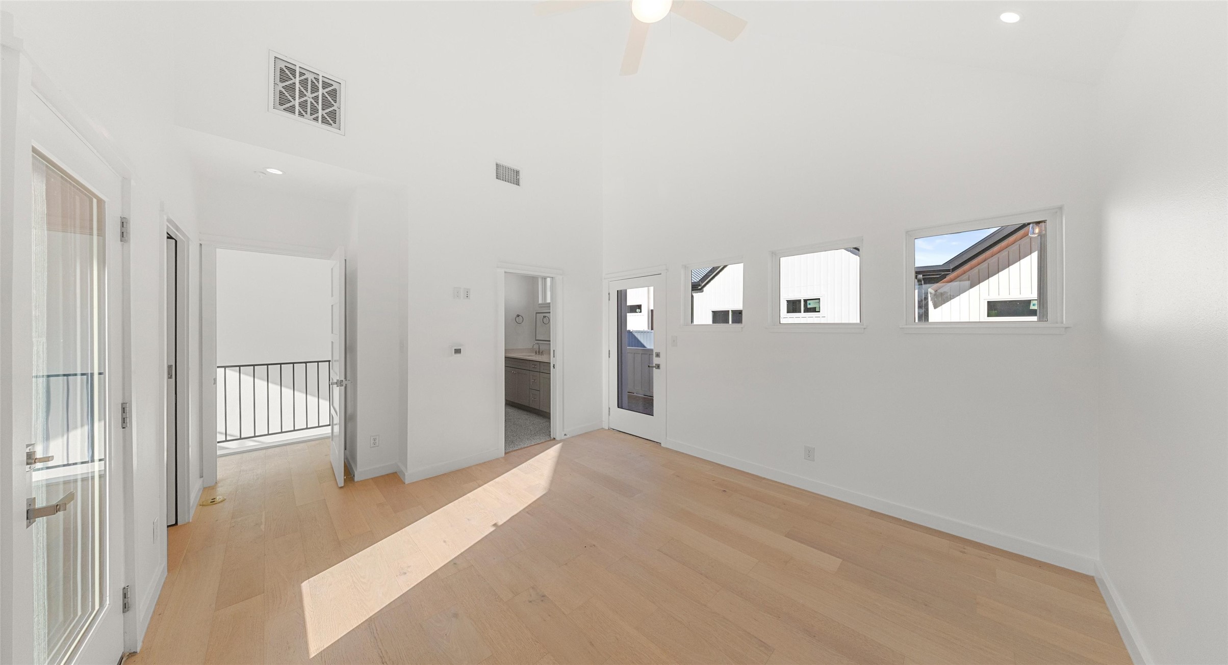 5912 Harold Court, Unit 106 Austin, TX 78721 - Photo 22 of 26 Warm wood flooring and abundant light create a space that feels like home the moment you walk in. Model No. 104 Shown.