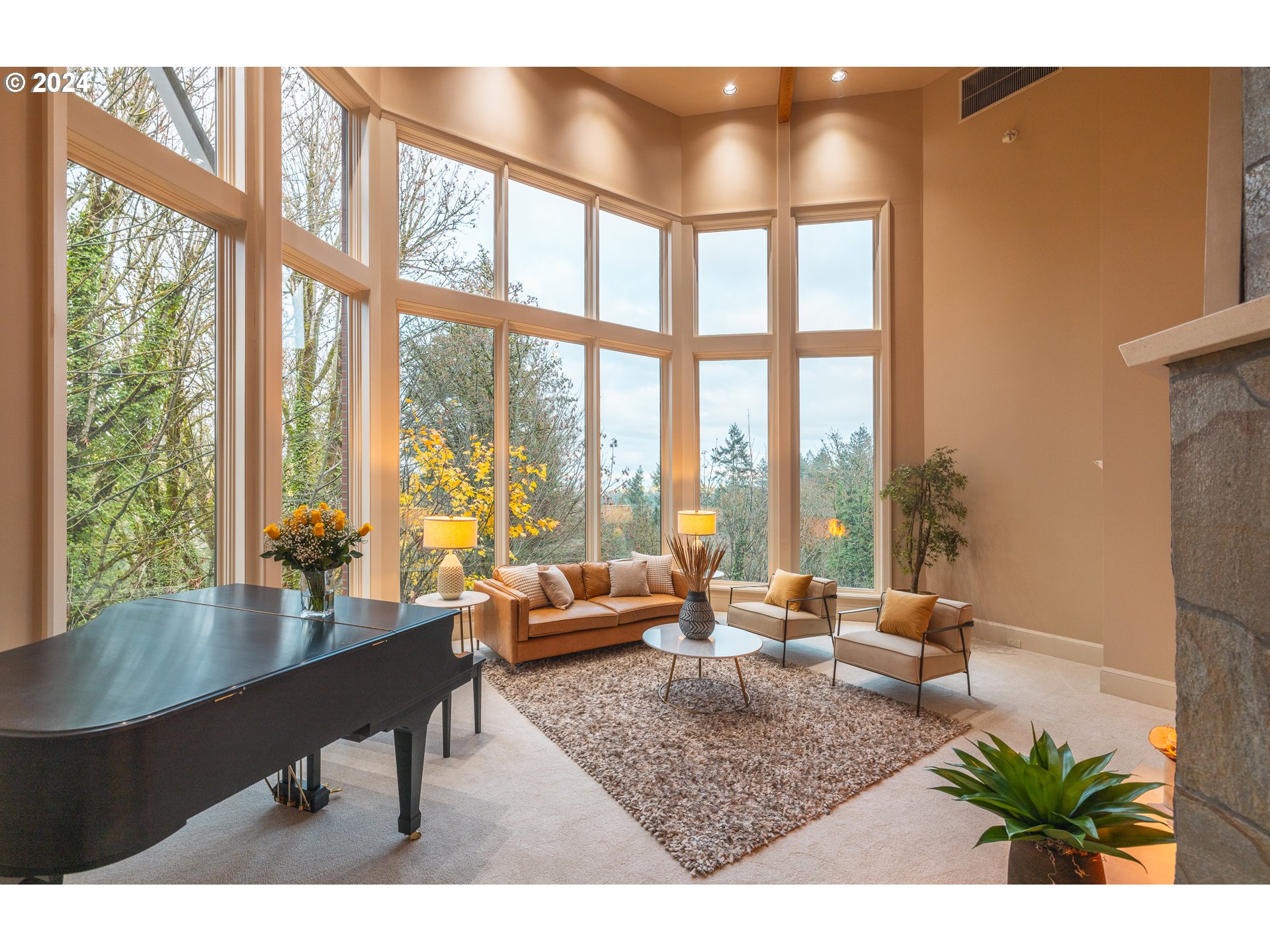 4335 Southwest Humphrey Boulevard Portland, OR 97221 - Photo 11 of 35 a living room with furniture and a floor to ceiling window