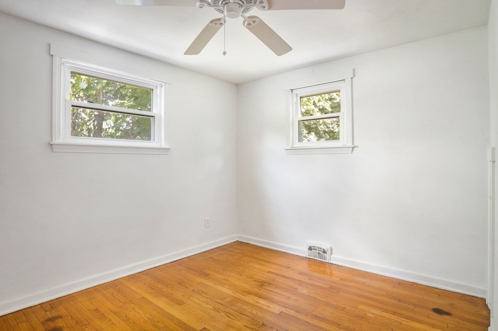 23 Plumtree Circle Springfield, MA 01118 - Photo 13 of 29 an empty room with a window and wooden floor