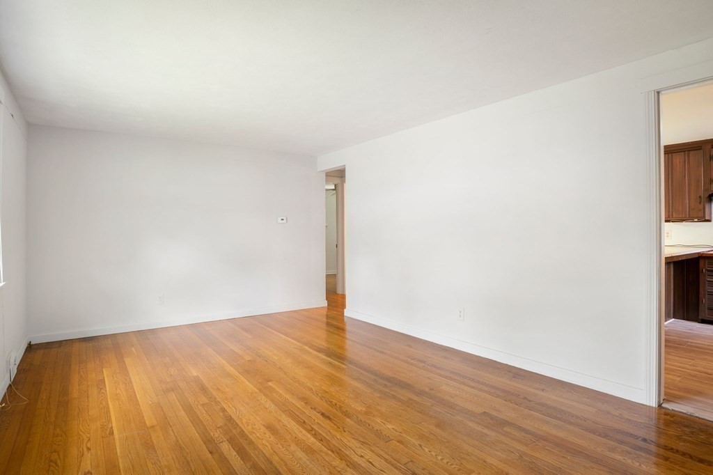 23 Plumtree Circle Springfield, MA 01118 - Photo 5 of 29 a view of an empty room with wooden floor