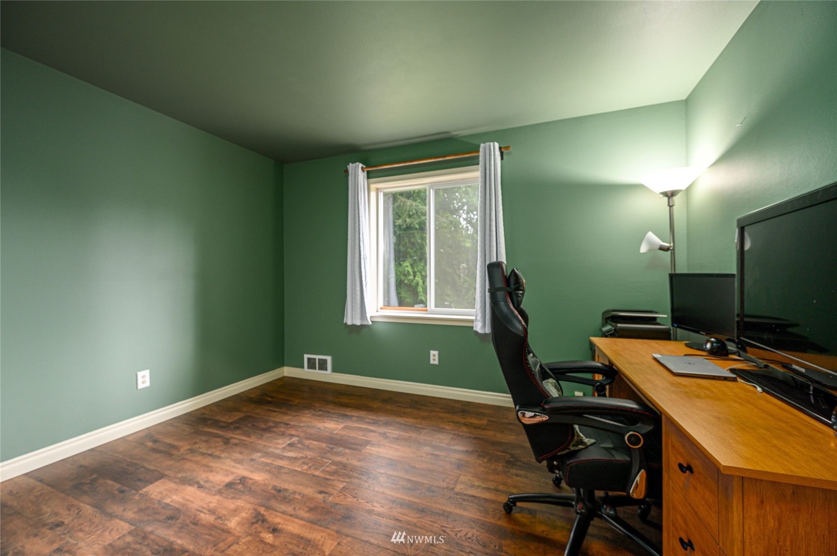 719 W Road Sedro-Woolley, WA 98284 - Photo 13 of 22 a view of a workspace with furniture and a window