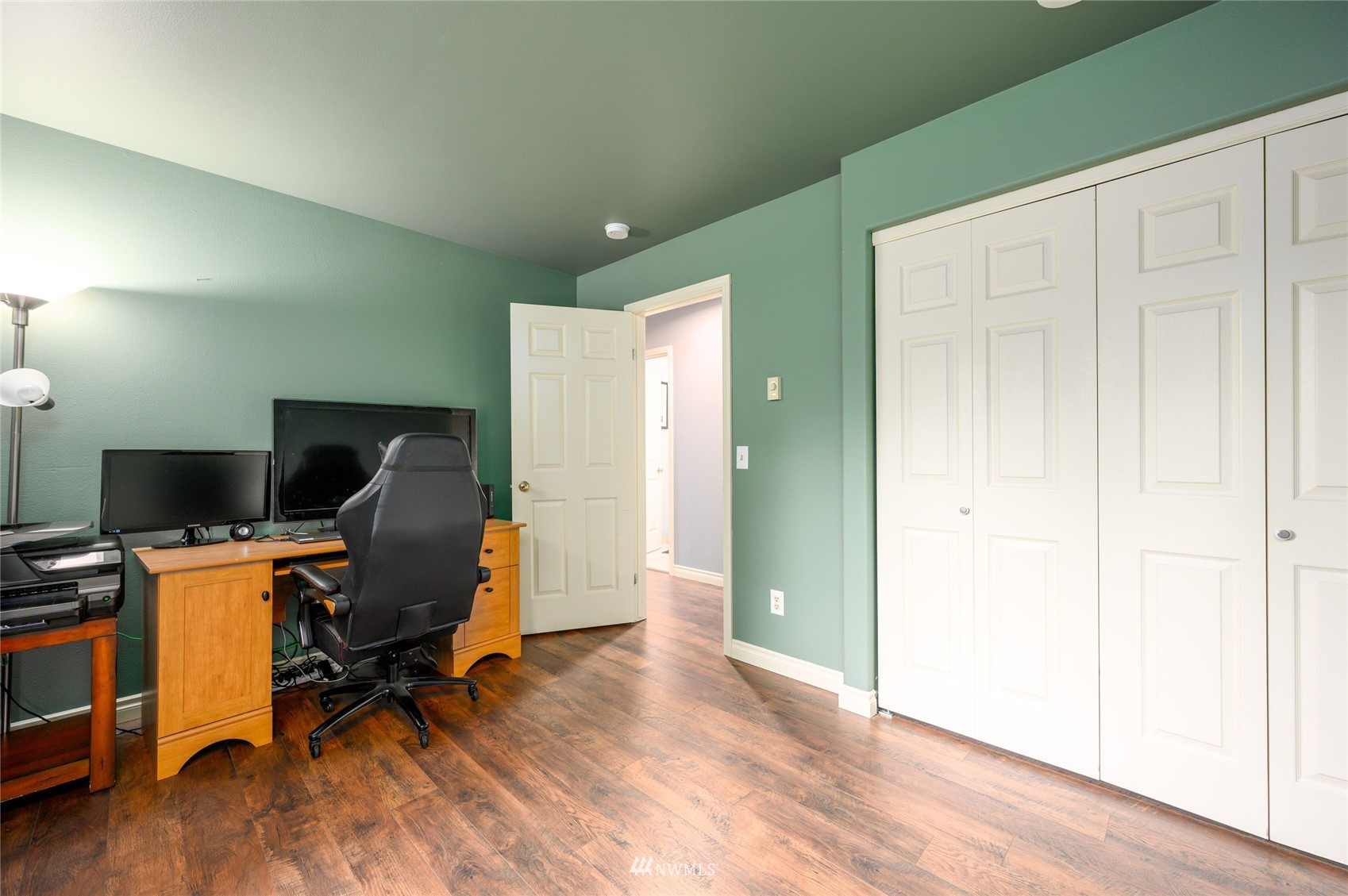 719 W Road Sedro-Woolley, WA 98284 - Photo 14 of 22 a view of workspace with wooden floor and windows