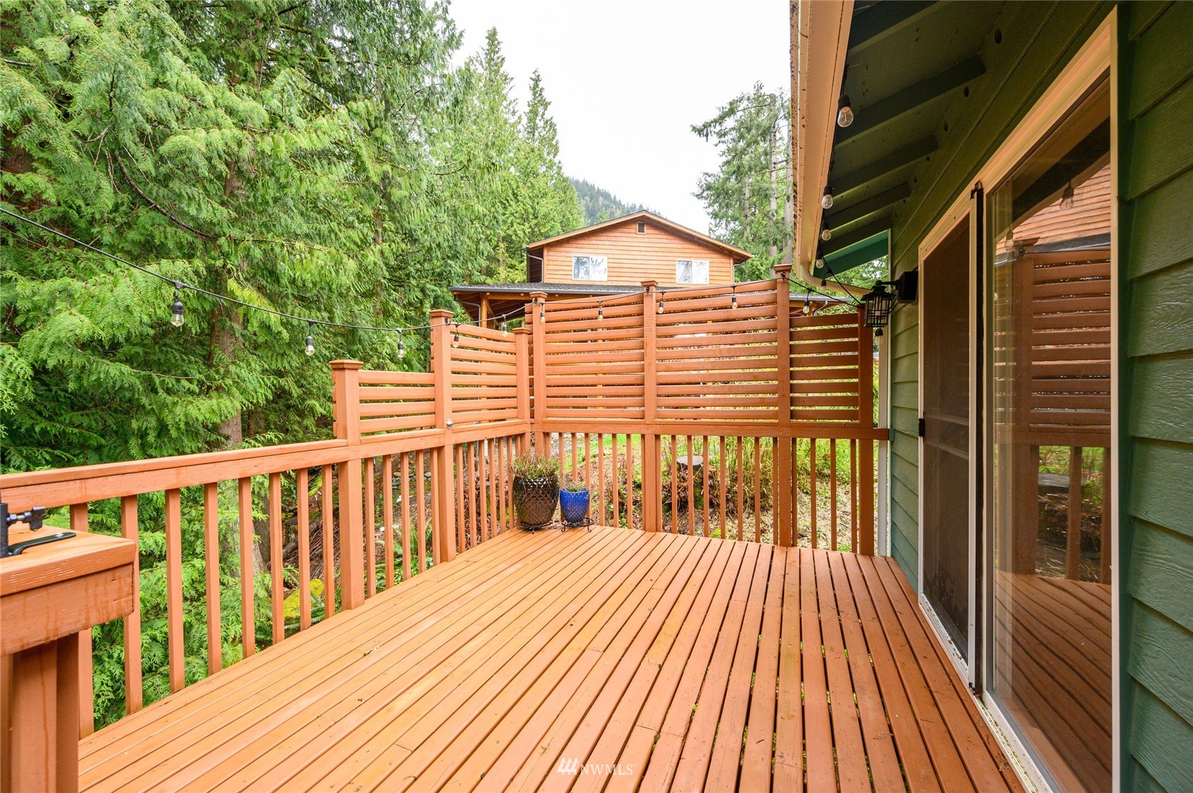 719 W Road Sedro-Woolley, WA 98284 - Photo 16 of 22 a view of a wooden deck with a yard