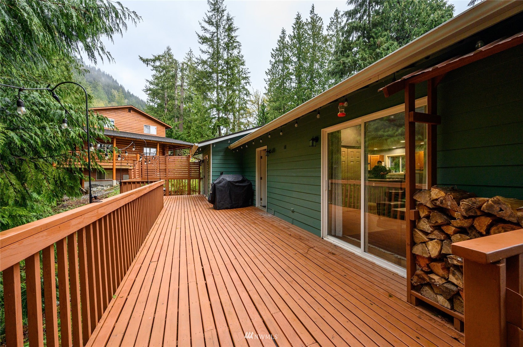 719 W Road Sedro-Woolley, WA 98284 - Photo 17 of 22 a balcony with wooden floor and outdoor seating