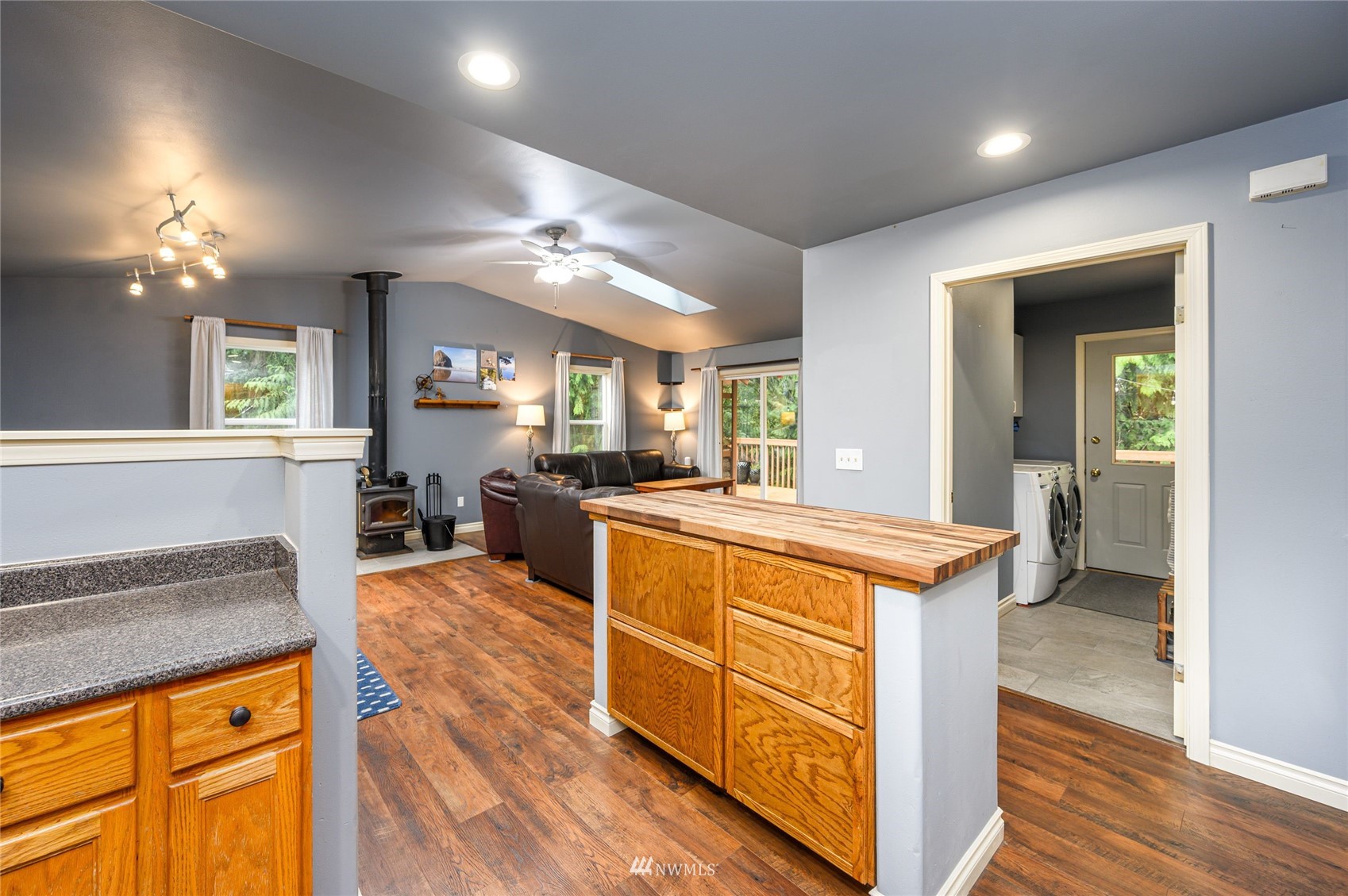 719 W Road Sedro-Woolley, WA 98284 - Photo 7 of 22 a kitchen with stainless steel appliances granite countertop sink stove top oven and cabinets