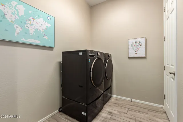 an entryway with wooden floor
