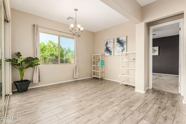 a view of livingroom with hardwood floor and a ceiling fan