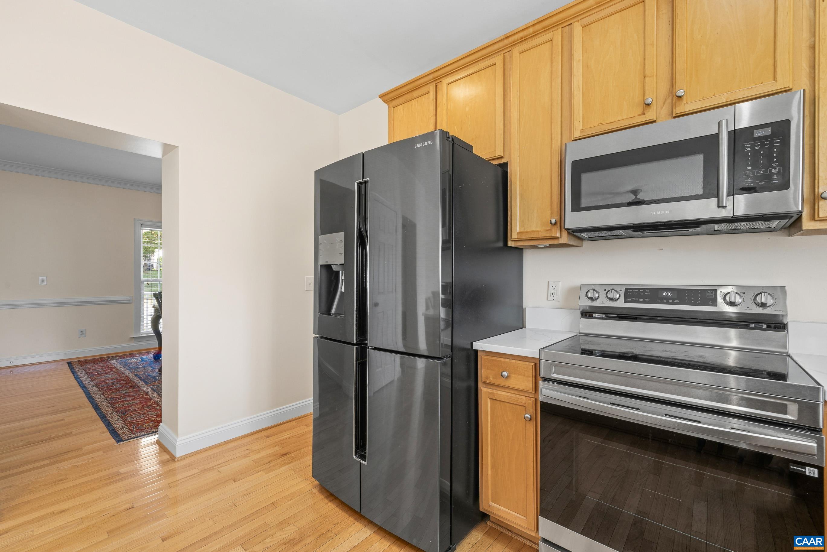 1236 Amber Ridge Road Charlottesville, VA 22901 - Photo 19 of 56 a kitchen with stainless steel appliances and wooden cabinets